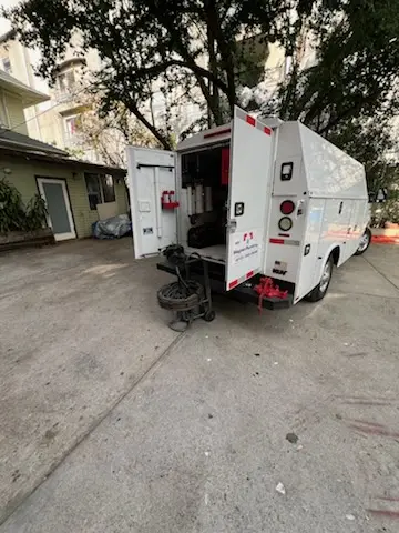 Magnet Plumbing service vehicle on-site for Grease Trap Cleaning in Westwood Heights